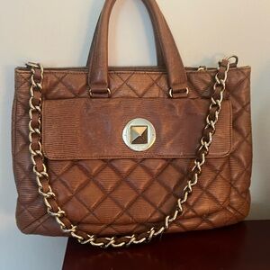 A quilted brown leather Kate Spade satchel with gold-tone hardware.. like new